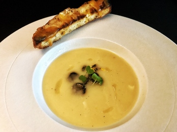 Cheddar and Beer soup with a drizzle of chilli oil, served with crispy garlic toast